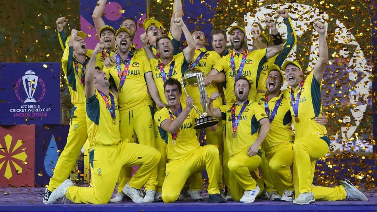 Australian players celebrate their World Cup trophy win.