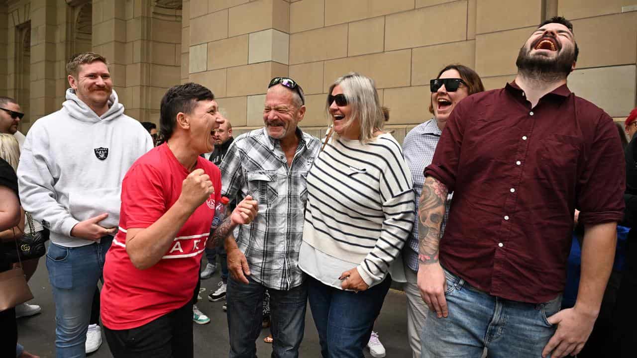 Fiona Hollowood (3rd right) and Heath Bond (right) react outside court