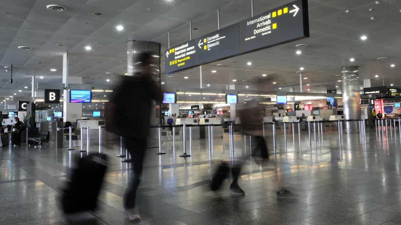 Travellers inside the airport.