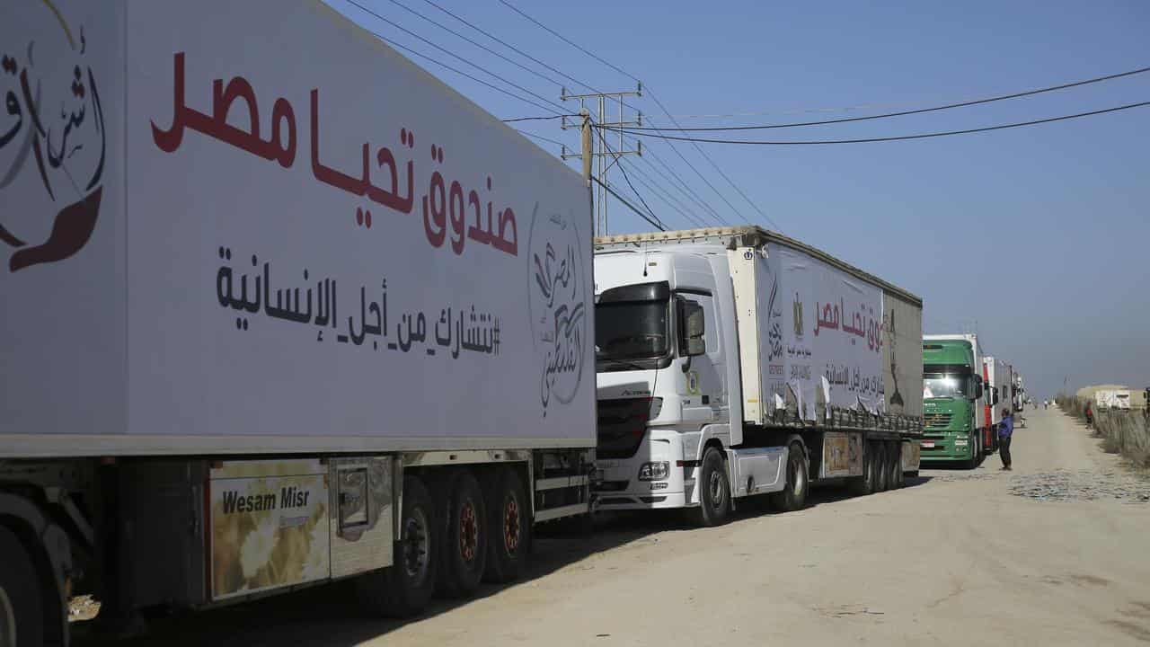 Trucks carrying humanitarian aid enter Gaza Strip from Egypt in Rafah