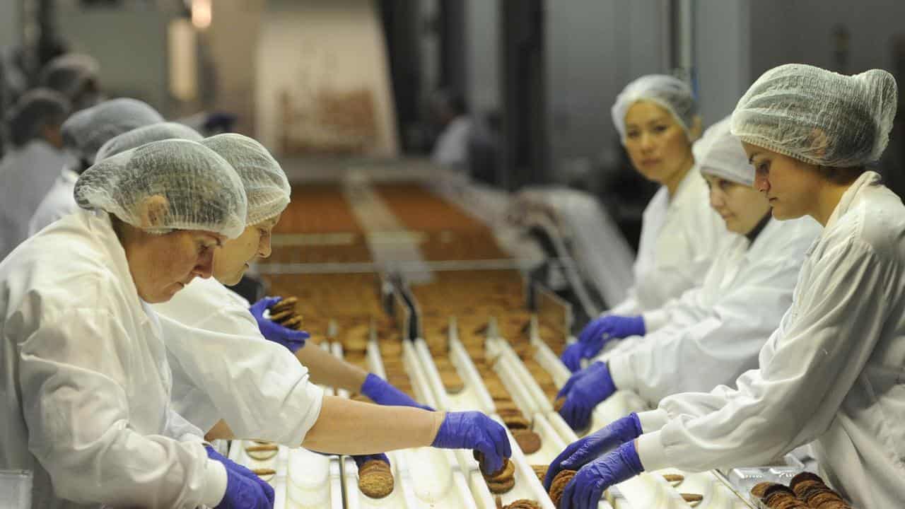 Workers at the Modern Baking Company factory in Melbourne