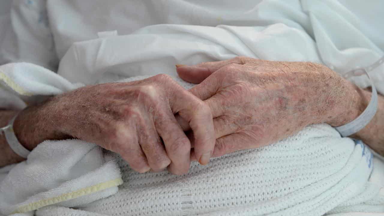 An elderly patient's hands