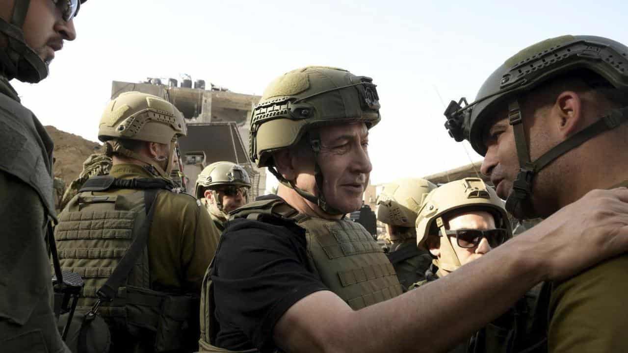 Israeli Prime Minister Benjamin Netanyahu greets soldiers