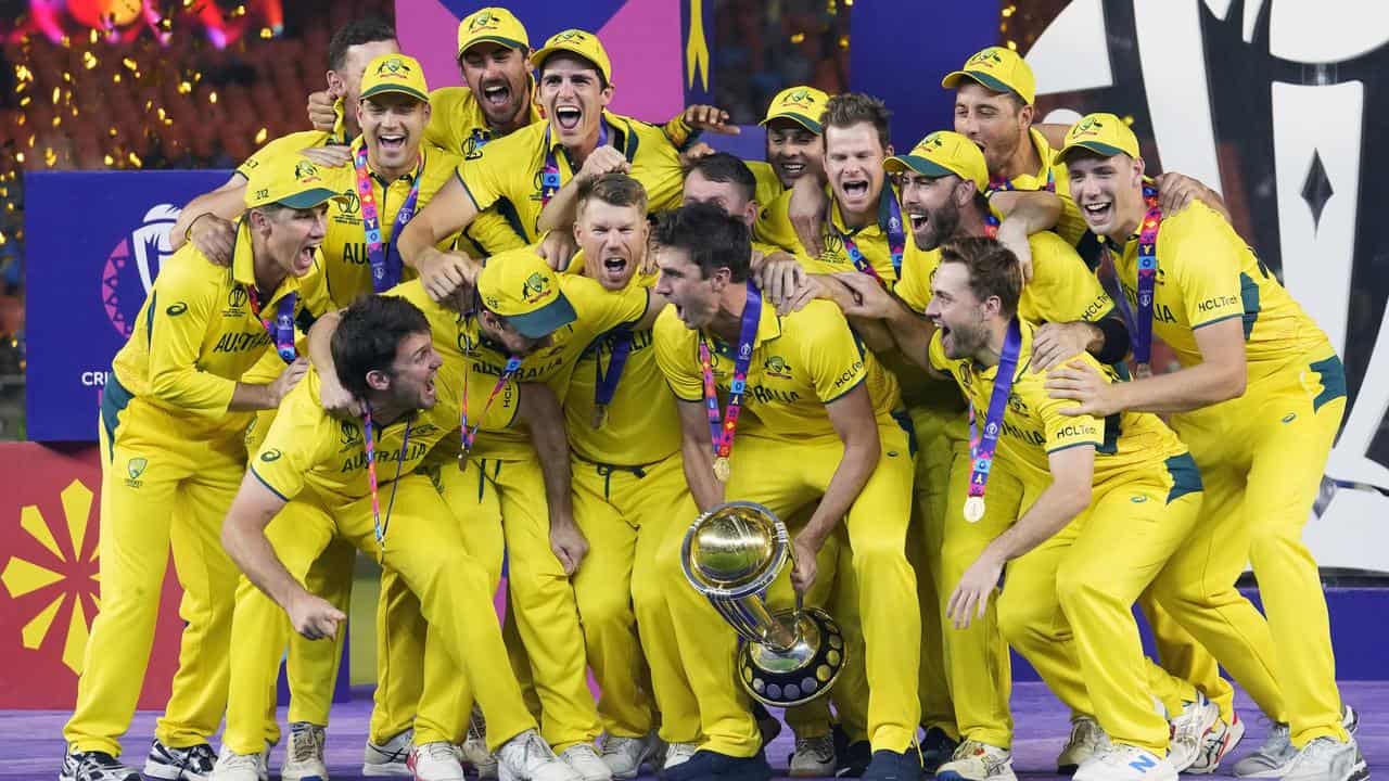 Captain Pat Cummins lifts the 2023 Cricket World Cup for Australia.