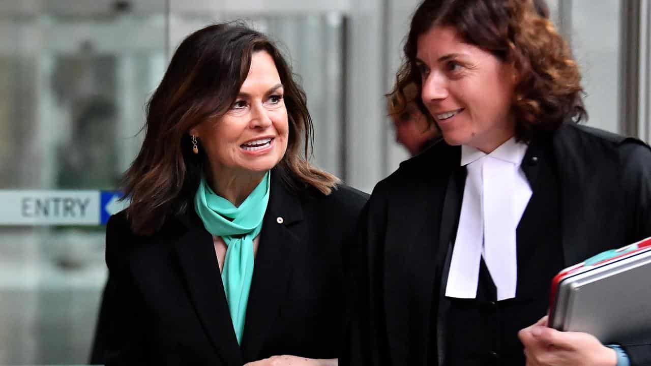 Lisa Wilkinson and her barrister outside court in Sydney.