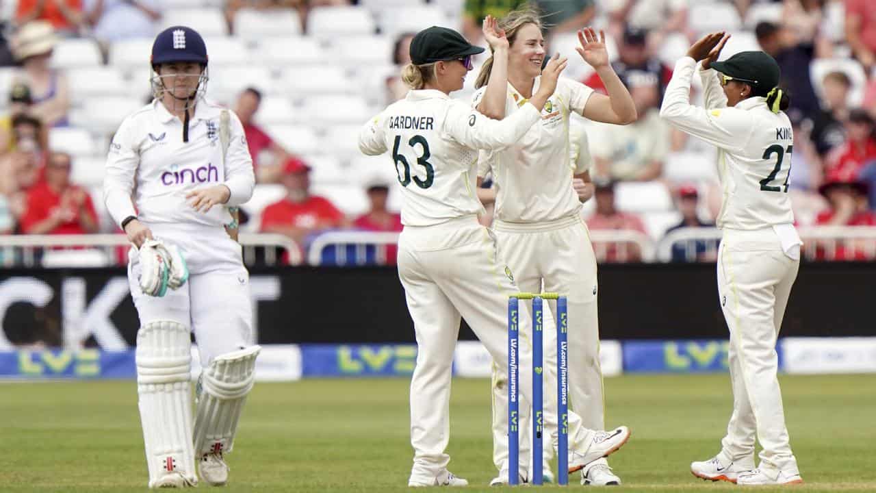 Ellyse Perry (second right) celebrates an England wicket.