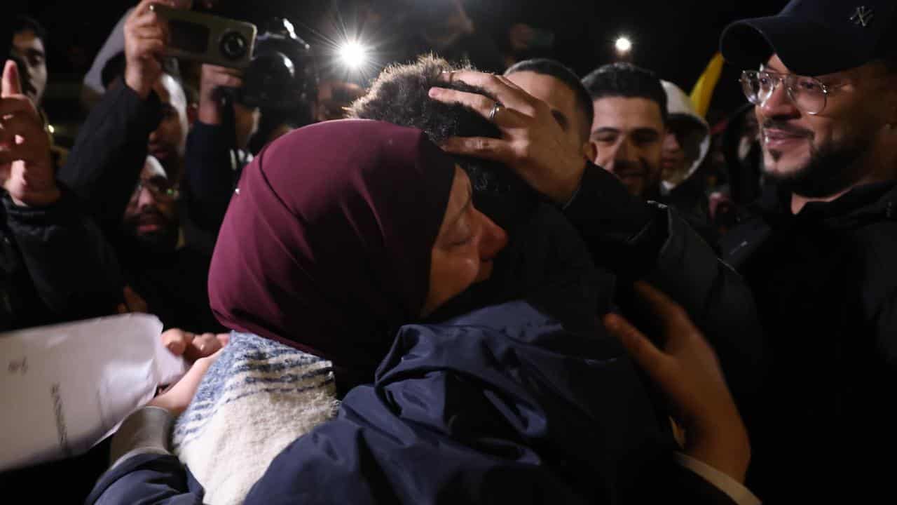 A Palestinian prisoner hugs a relative in Ramallah after her release