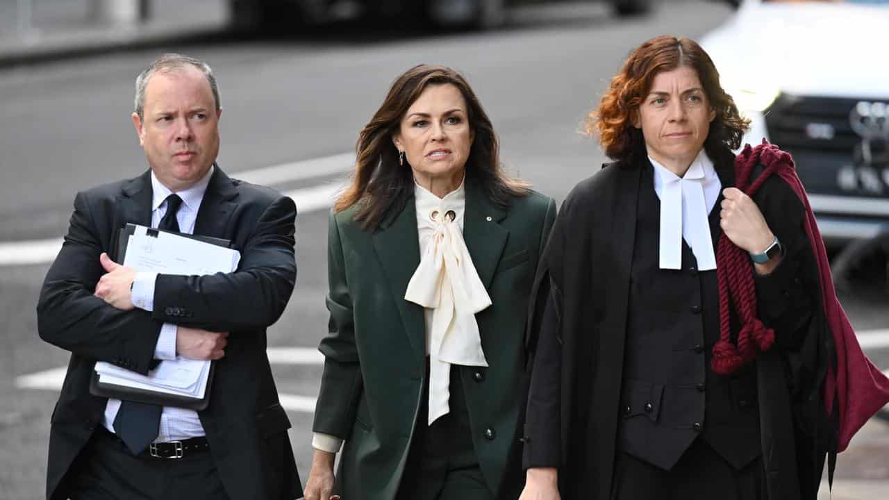 Lisa Wilkinson, centre, arrives at Federal Court in Sydney.