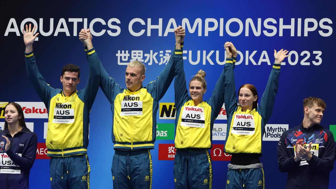 Australia's 4x100m mixed freestyle medallists in Japan.