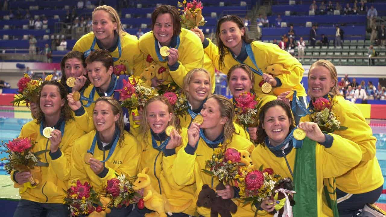 Australian water polo players with their 2000 Olympics gold medals.