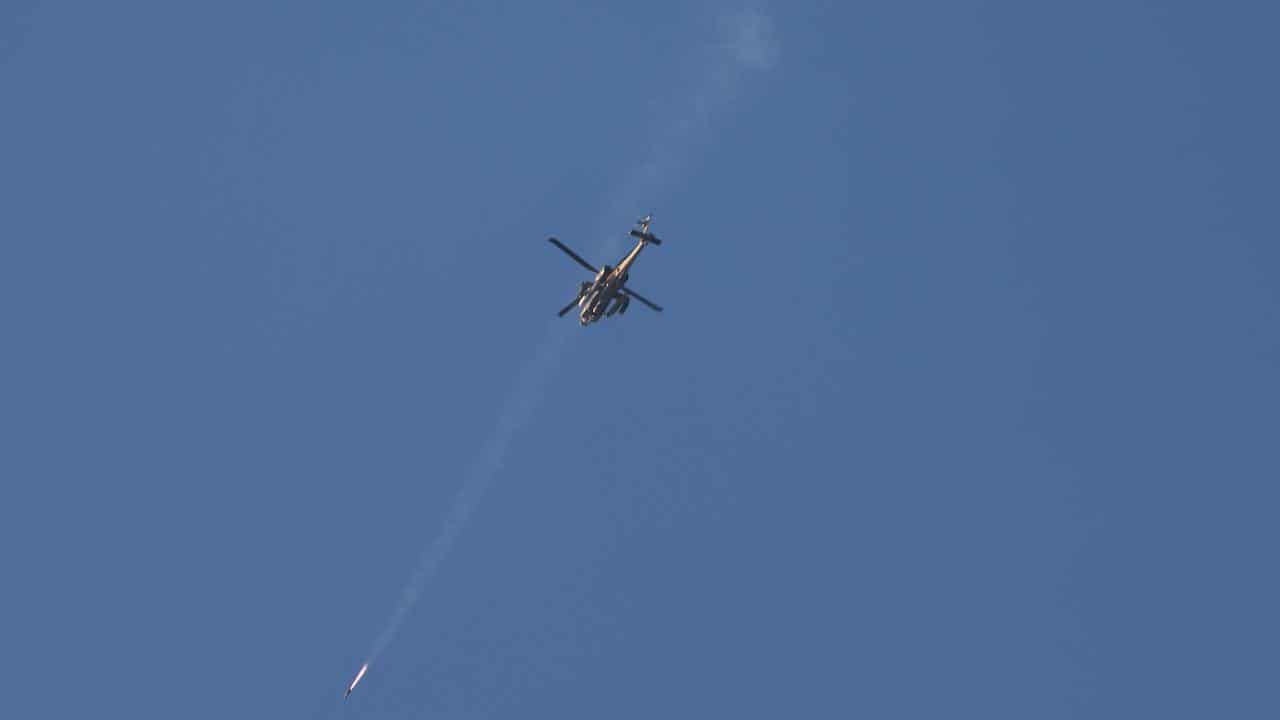 Israeli apache firing missile toward targets in the Gaza Strip