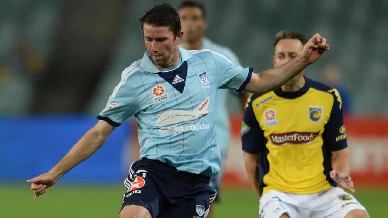 Terry McFlynn (left) in action for Sydney FC. 