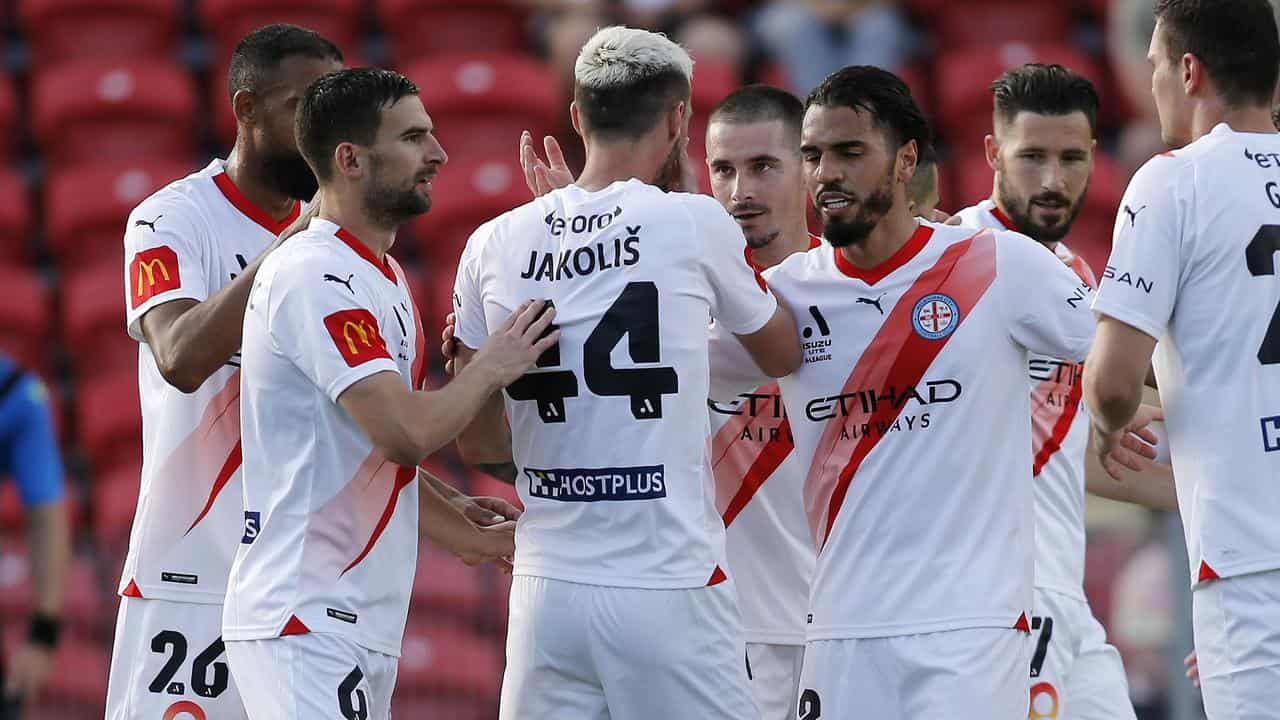 Melbourne City players celebrate a goal in their 2-0 win at Newcastle.