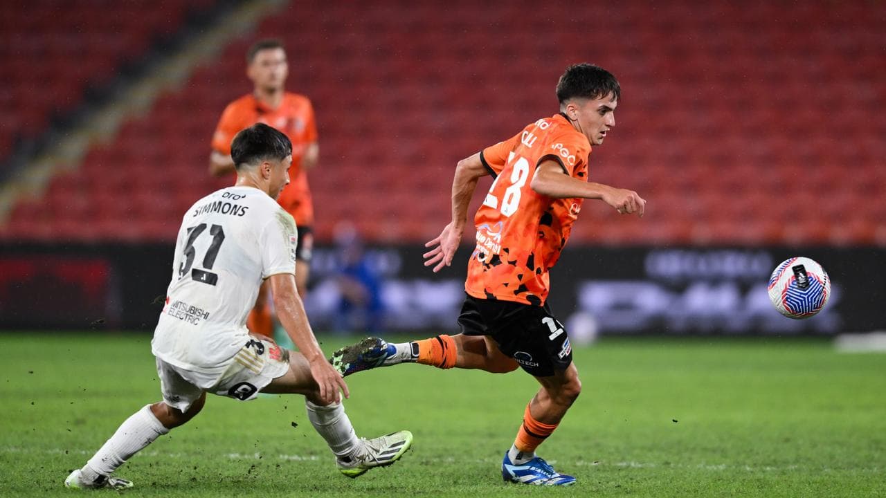 Brisbane Roar midfielder Shae Cahill (right).