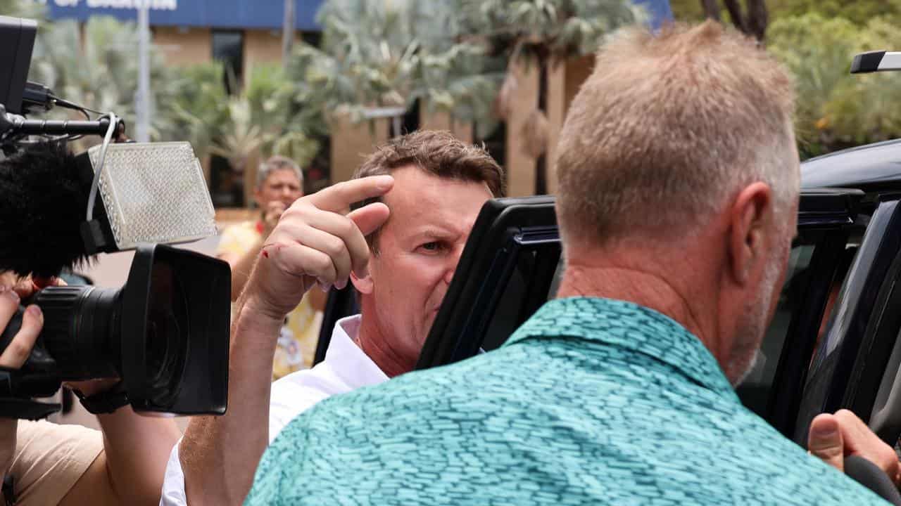 Reporter Steve Marshall confronts Nigel Scullion (right)