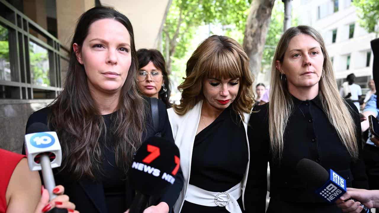 Emma Walters (2nd right) leaves the Melbourne Magistrates Court