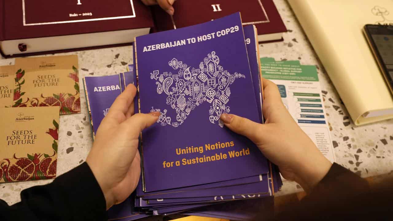 Pamphlets that read Azerbaijan to host COP29