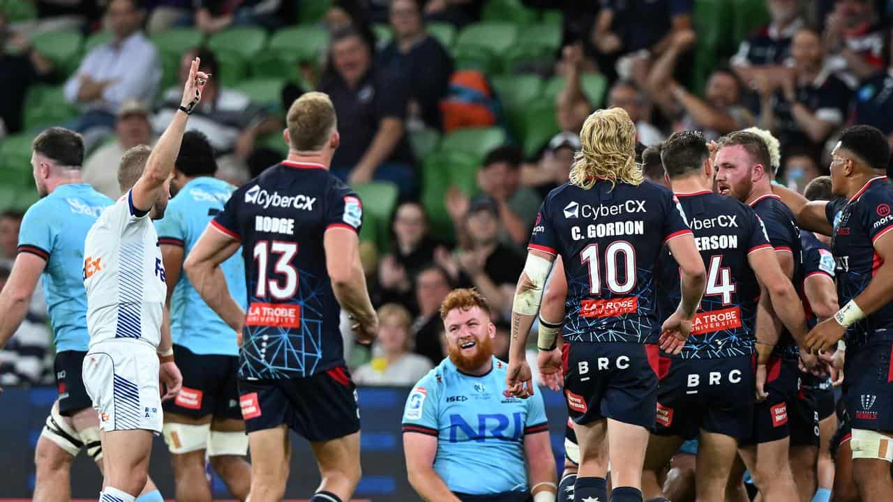 A scrum breaks up in a Waratahs-Rebels match.