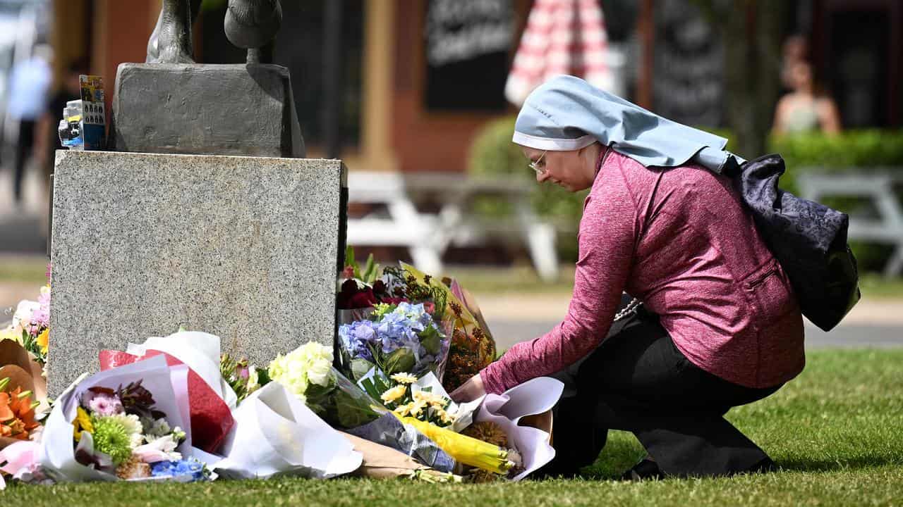 A nun lays tribute to the crash victims (file image)