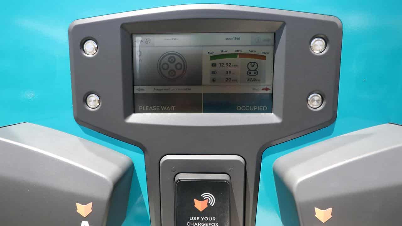 A progess screen on an EV charging station.