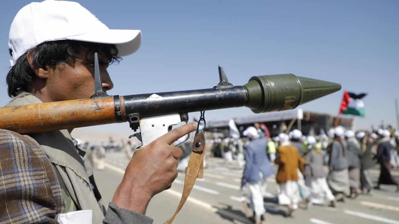 Members of the Houthis' army march in Yemen