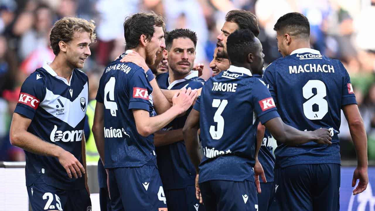 Melbourne Victory celebrate a goal against Newcastle. 