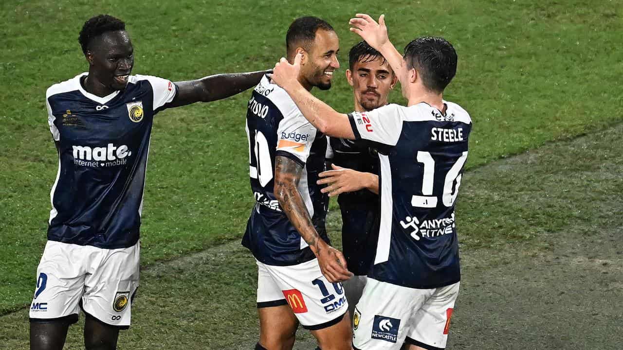 Mariners players congratulate Marco Tulio (second left)