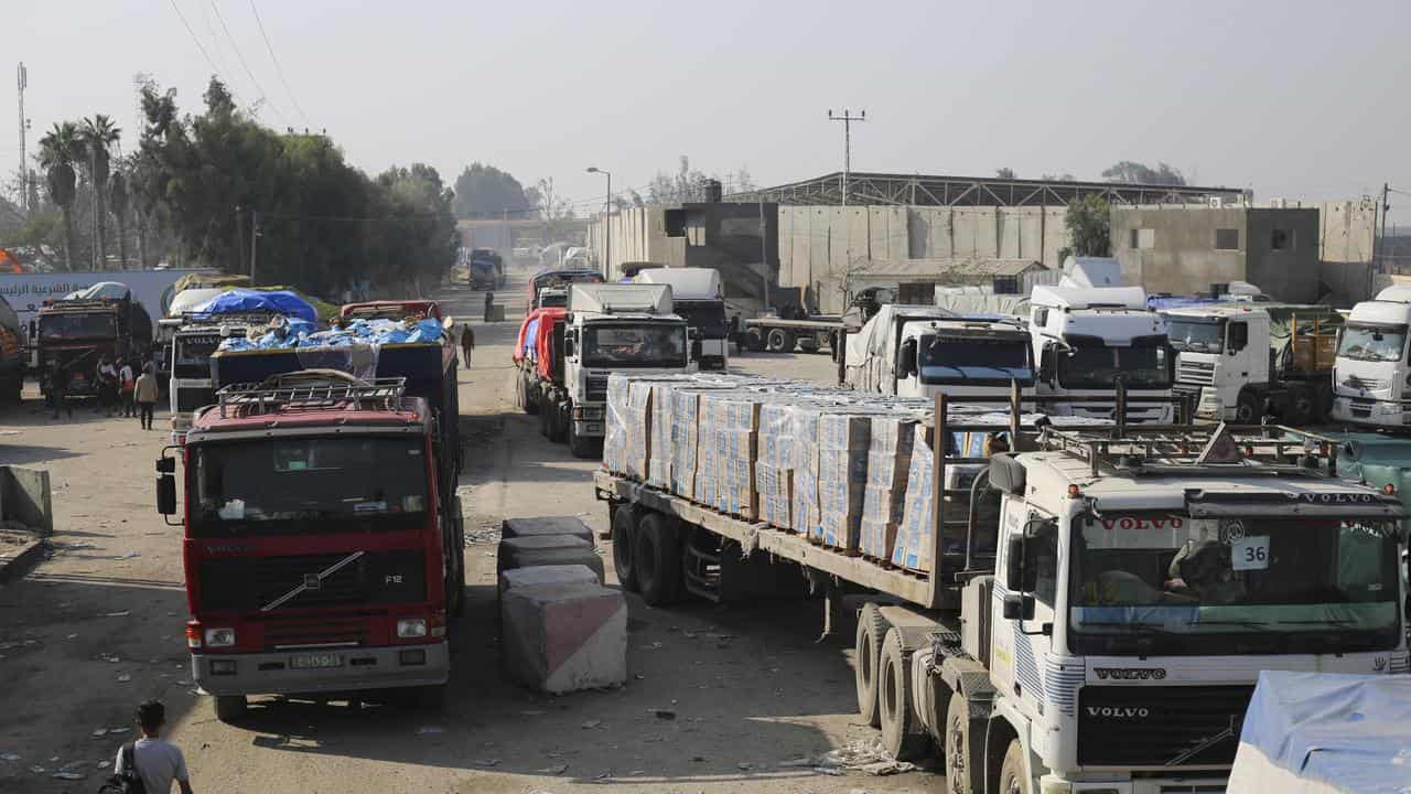 Aid trucks enter through the Kerem Shalom crossing into Gaza