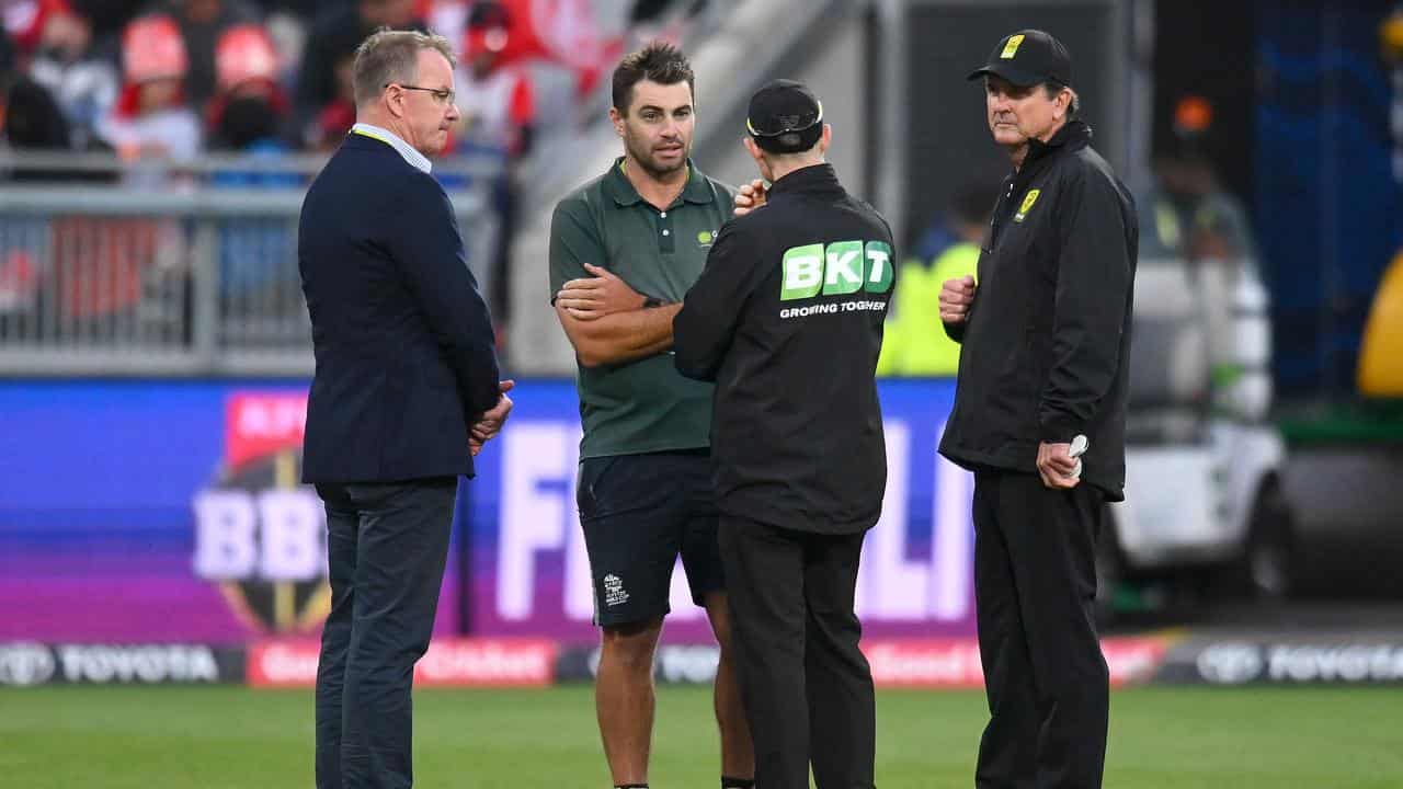 Match officials speak to ground staff at GMHBA Stadium