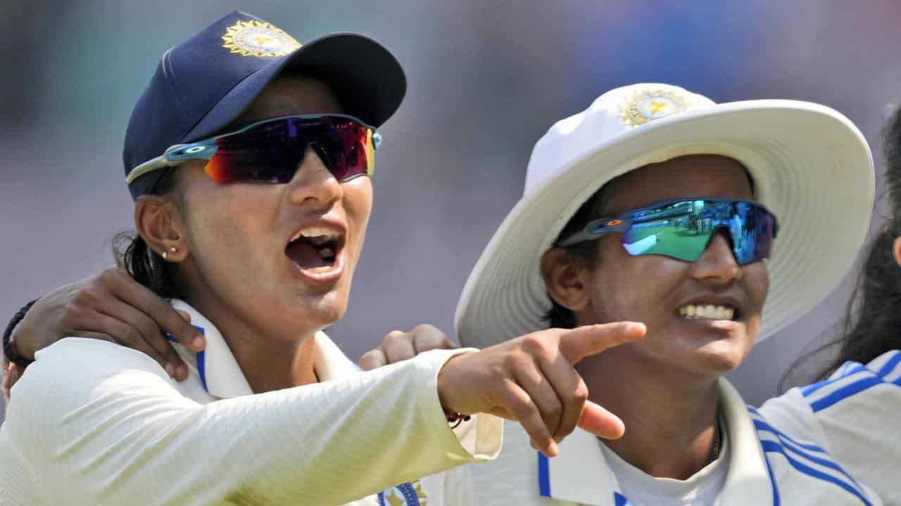 Sneh Rana (left) took 4-63 as India cleaned up Australia for 261.