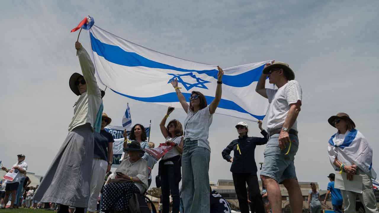 People participate in a pro-Israel demonstration in Sydney.