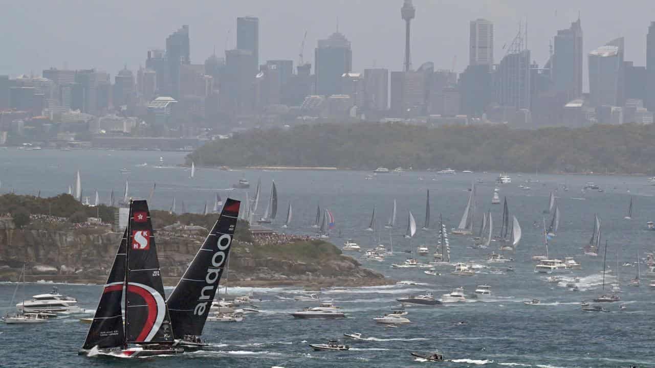 Scallywag (left) and Andoo Comanche exit Sydney Harbour on Tuesday.