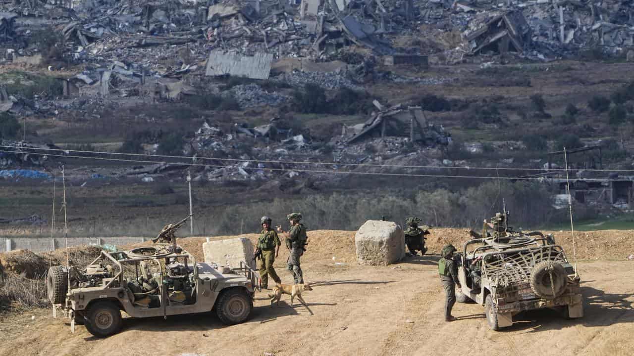 Israeli soldiers take up positions near the Gaza Strip border,