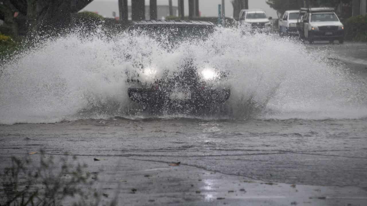 Cars drive through water