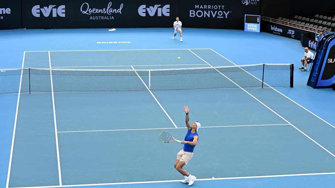 Rafael Nadal (bottom) serves to Andy Murray