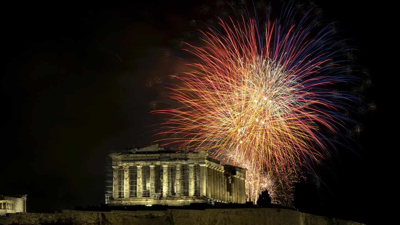 Fireworks explode over the ancient Partnenon temple in Athens.