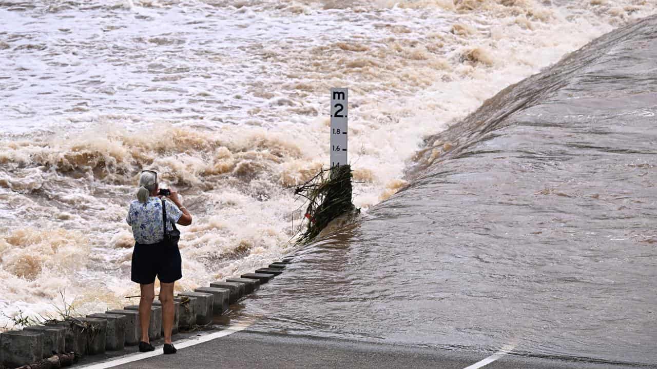 The Coomera river is seen cutting a road at Clagiraba Road