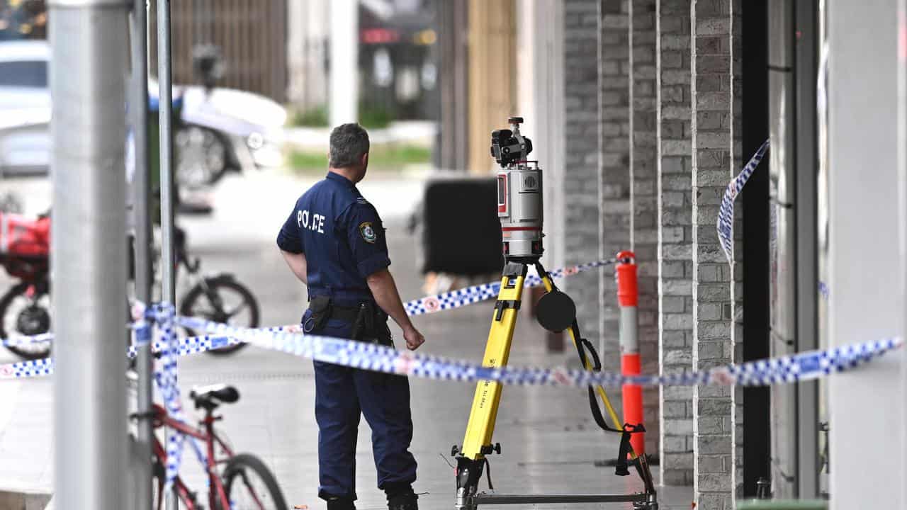 Police officer at the scene of a shooting in Bondi Junction.