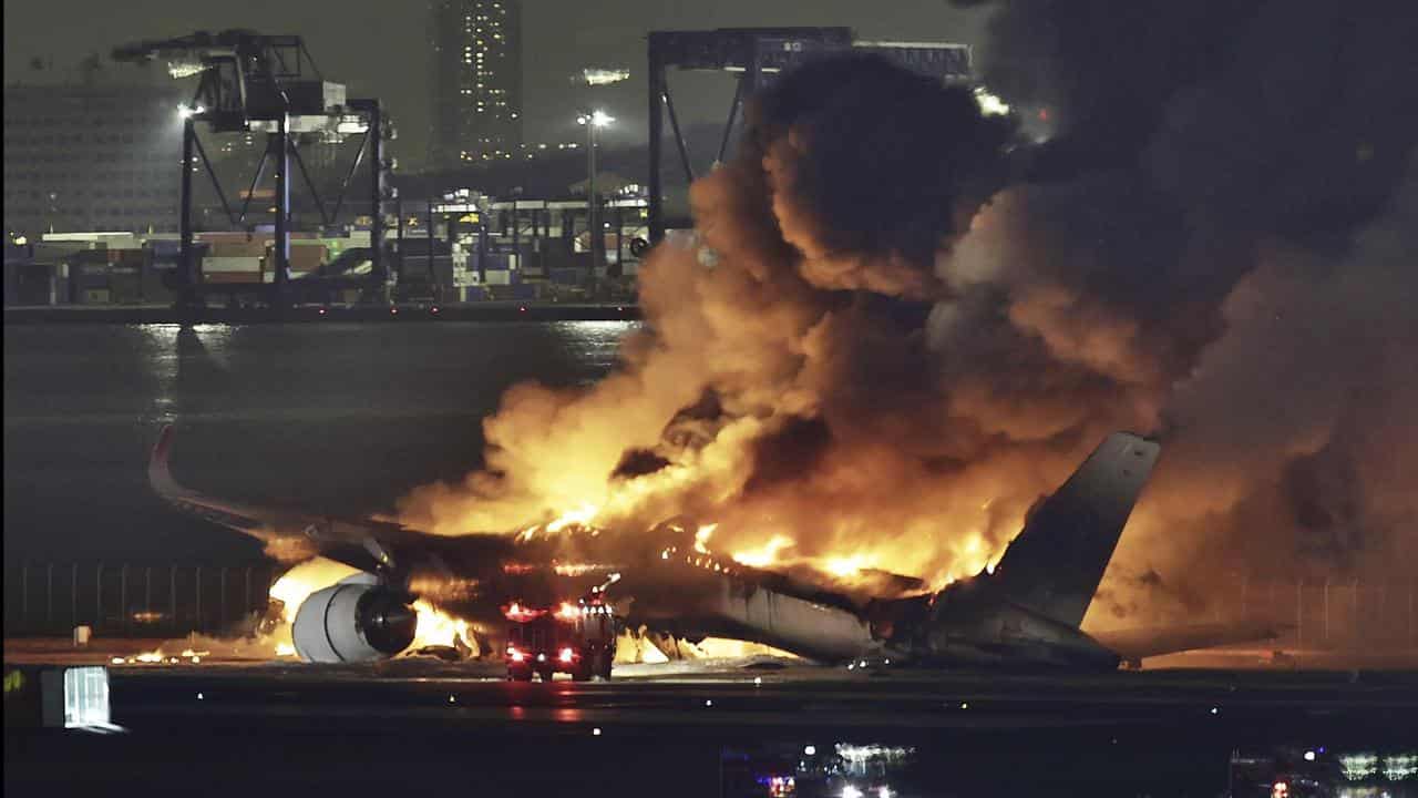 The burning Japan Airlines plane 