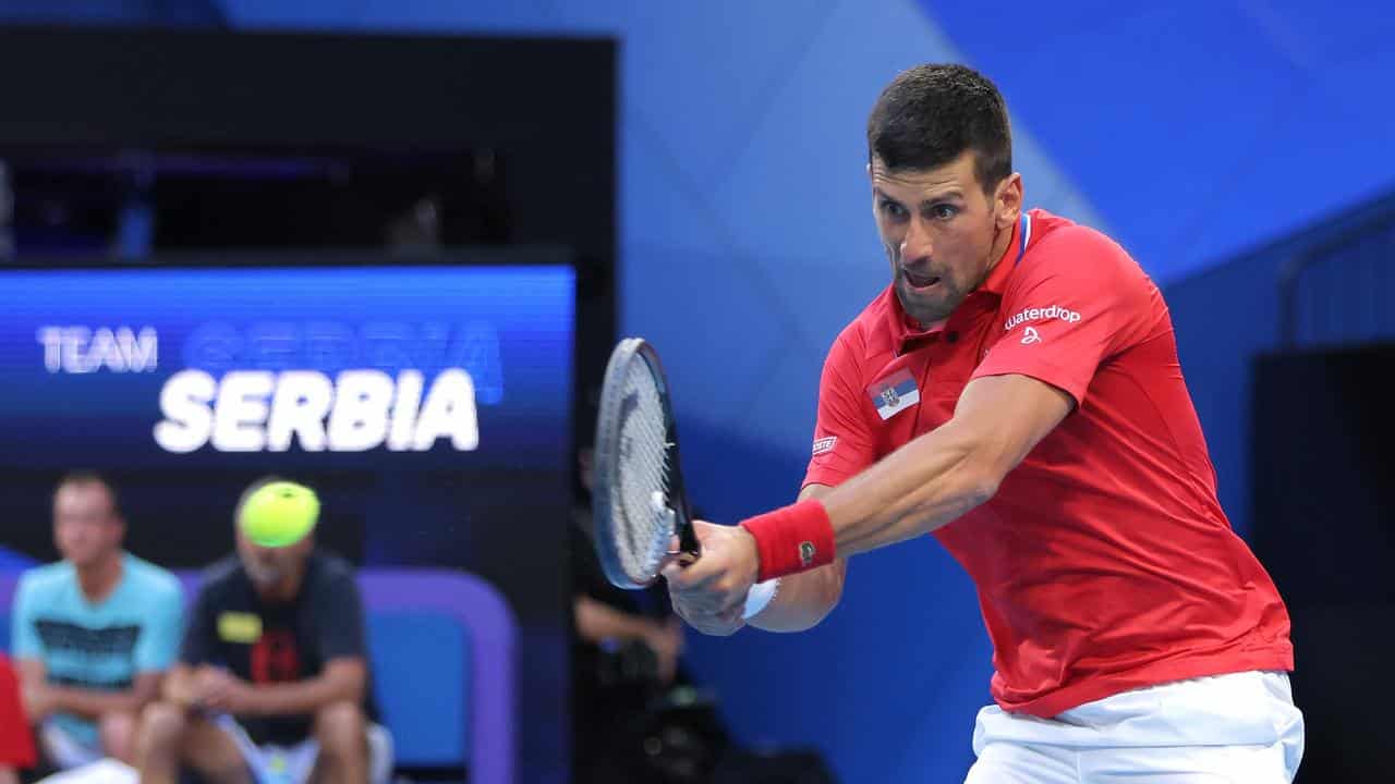 Novak Djokovic returns against Alex de Minaur in Perth.