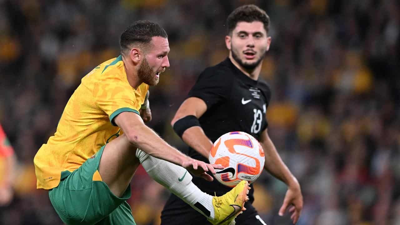 Socceroos forward Martin Boyle (left).