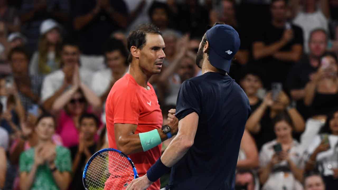 Nadal and Jordan Thompson shake hands after their match.