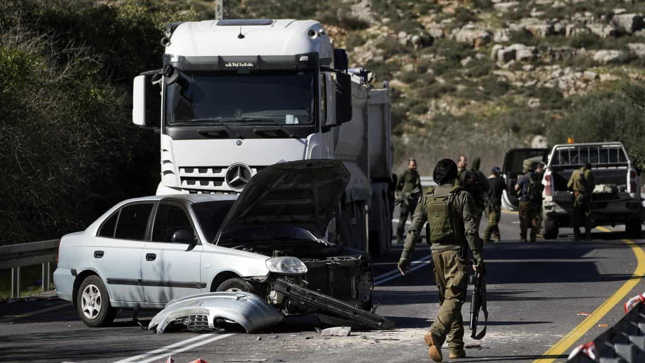 Israeli forces at the scene of an attack in the West Bank 