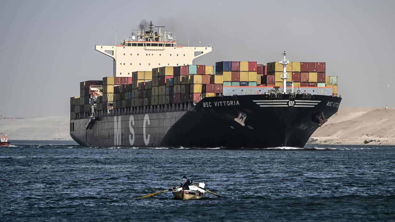 A container ship crosses the Suez Canal towards the Red Sea in Egypt.