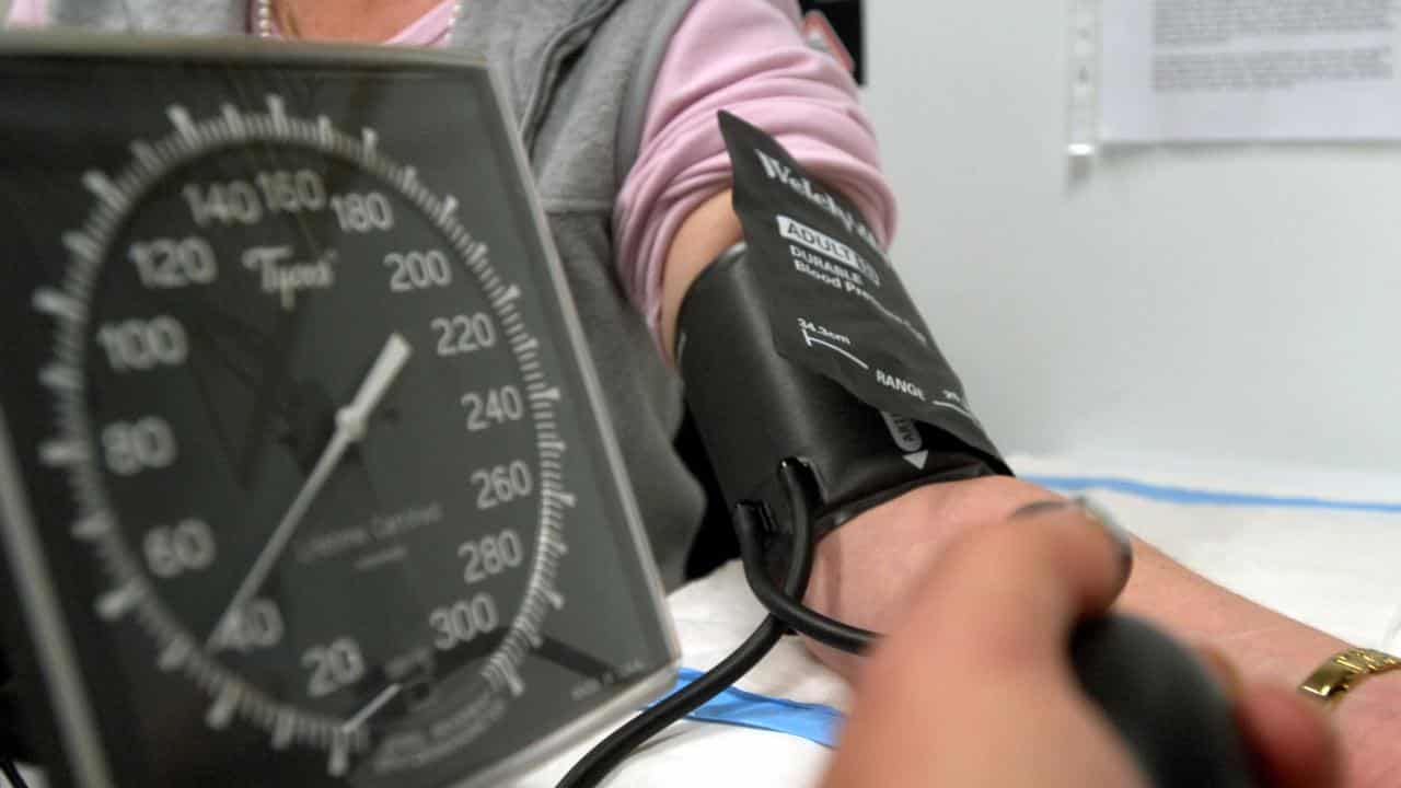 A patient has their blood pressure checked.