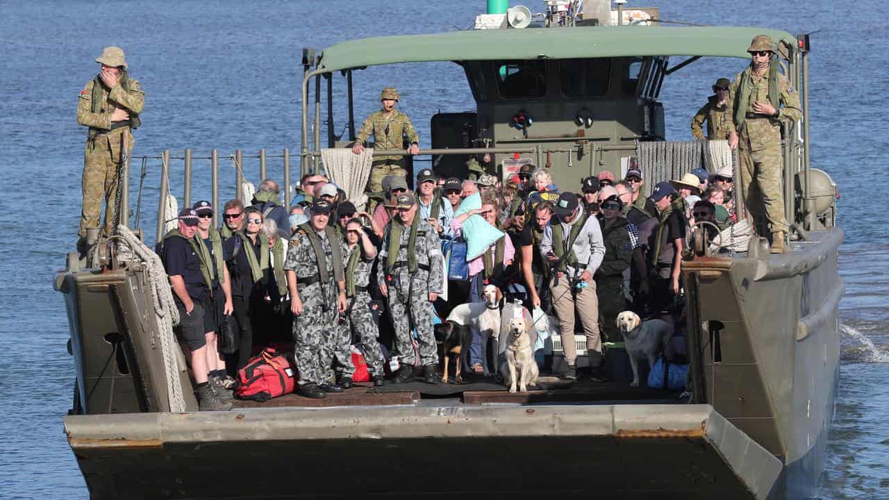 Evacuees on a defence landing craft at Hastings, Victoria in 2020.