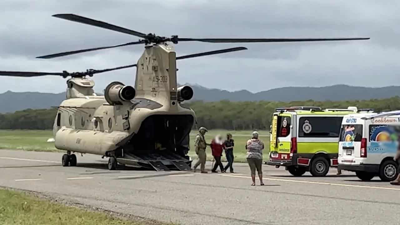 ADF Chinook helicopter bringing evacuees and resources to Cooktown.