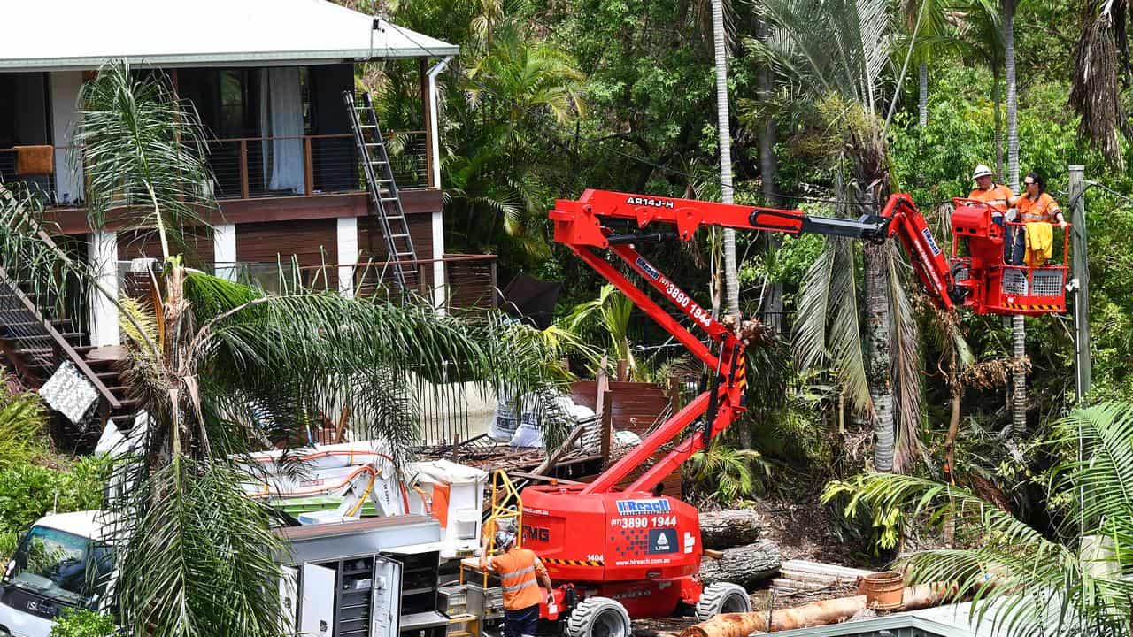 Wokers help clear up storm damage in Mount Tamborine