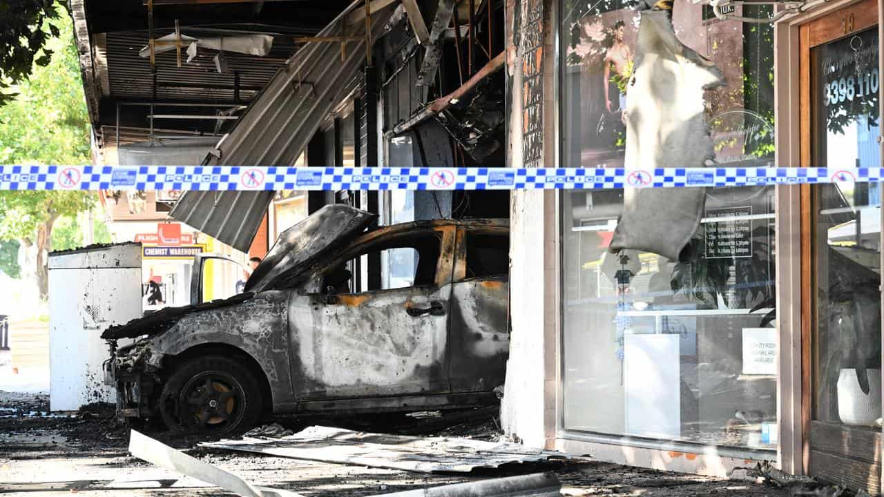 Burnt car at a tobacco shop in Altona.