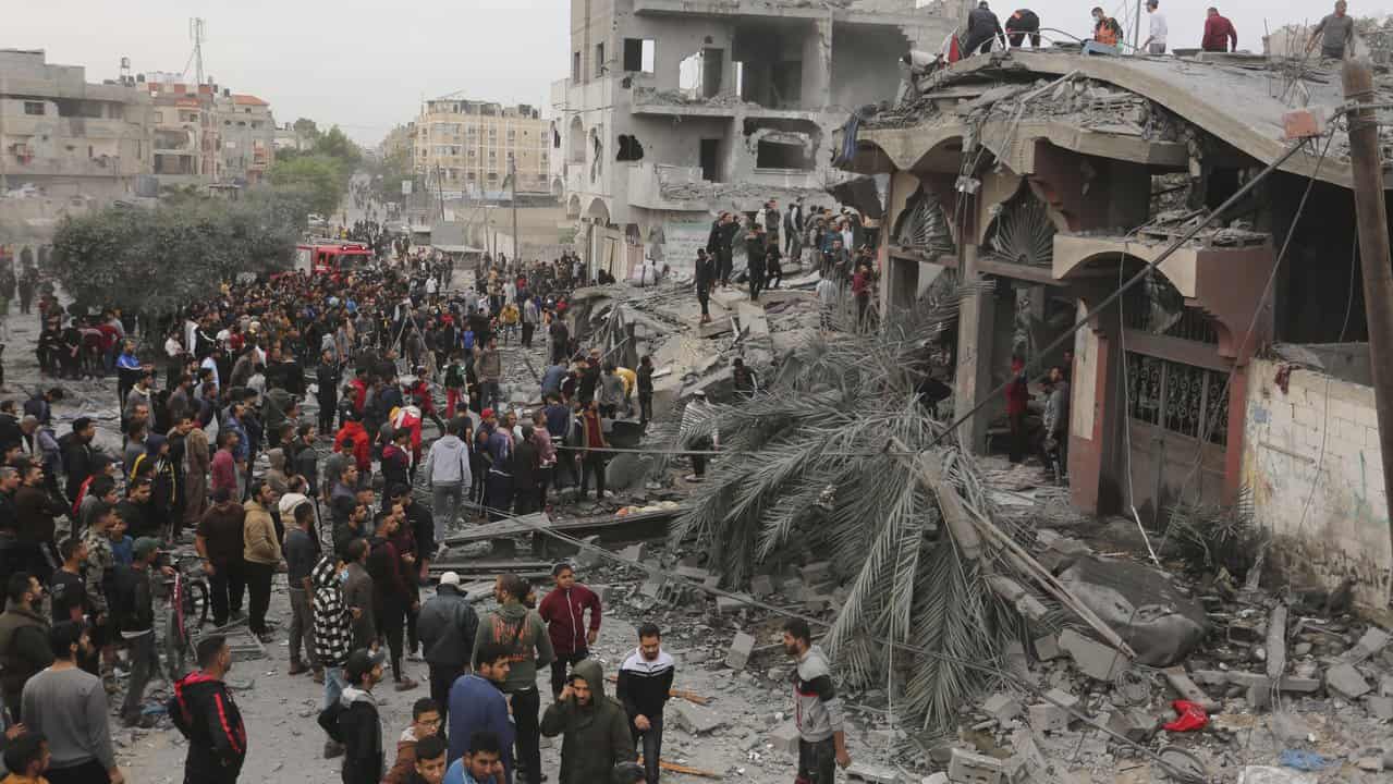 Palestinians search for survivors of the Israeli bombing in Gaza